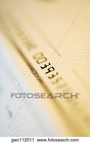 Stock Image - Close-up of numbers on a check. Fotosearch