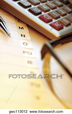 Close-up of a calculator with a pen and a personal organizer View Large Photo Image Stock Image - Close-up of a calculator with a pen and a personal organizer. Fotosearch