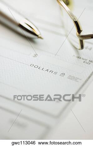 Close-up of a pen and eyeglasses on a check View Large Photo Image Stock Photograph - Close-up of a pen and eyeglasses on a check. Fotosearch
