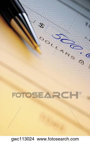 Close-up of a pen on a check View Large Photo Image Picture - Close-up of a pen on a check. Fotosearch
