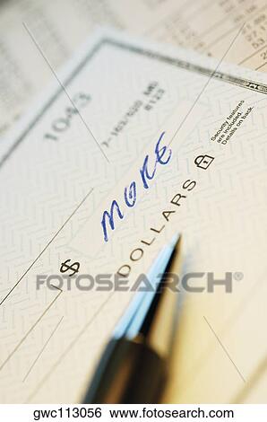 Close-up of a pen on a check View Large Photo Image Stock Photograph - Close-up of a pen on a check. Fotosearch