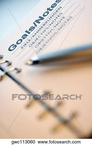 Stock Image - Close-up of a pen on a personal organizer. Fotosearch