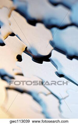 Close-up of jigsaw puzzle pieces View Large Photo Image Stock Photo - Close-up of jigsaw puzzle pieces. Fotosearch