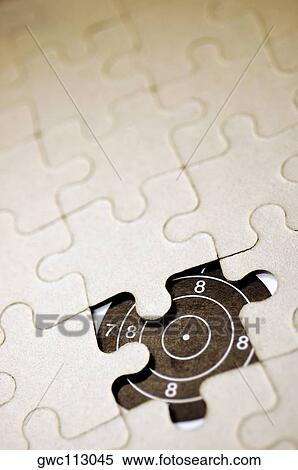 Stock Photography - Piece missing from a jigsaw puzzle. Fotosearch
