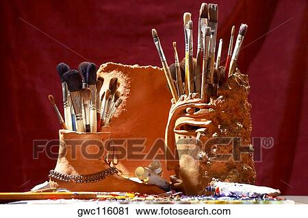 Assortment of paintbrushes in holders View Large Photo Image Stock Image - Assortment of paintbrushes in holders. Fotosearch