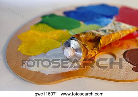 Stock Image - Close-up of a paint tube on a palette. Fotosearch