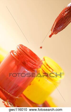 Close-up of a paintbrush over a bottle of red paint View Large Photo Image Stock Image - Close-up of a paintbrush over a bottle of red paint. Fotosearch