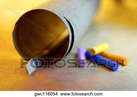 Close-up of a roll of canvas and a paintbrush with crayons View Large Photo Image Picture - Close-up of a roll of canvas and a paintbrush with crayons. Fotosearch