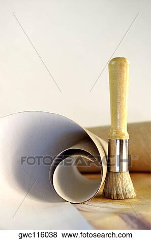 Close-up of a roll of canvas and a paintbrush View Large Photo Image Stock Photo - Close-up of a roll of canvas and a paintbrush. Fotosearch