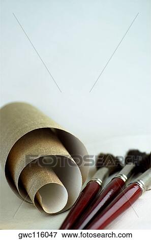 Close-up of a roll of canvas and paintbrushes View Large Photo Image Stock Photo - Close-up of a roll of canvas and paintbrushes. Fotosearch