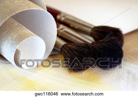 Close-up of a roll of canvas and paintbrushes View Large Photo Image Stock Photograph - Close-up of a roll of canvas and paintbrushes. Fotosearch