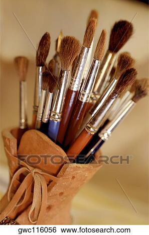 Close-up of paintbrushes in a holder View Large Photo Image Stock Photograph - Close-up of paintbrushes in a holder. Fotosearch
