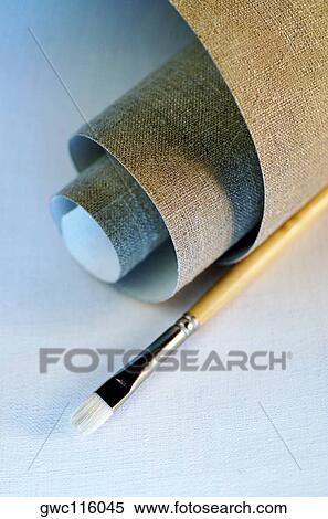 High angle view of a roll of canvas and a paintbrush View Large Photo Image Stock Photography - High angle view of a roll of canvas and a paintbrush. Fotosearch