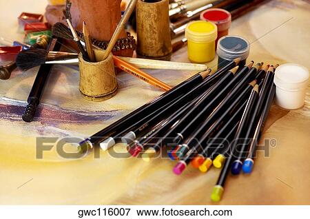 High angle view of color pencils with paintbrushes and paints View Large Photo Image Stock Photo - High angle view of color pencils with paintbrushes and paints. Fotosearch
