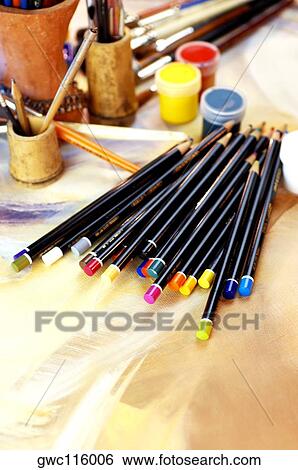 High angle view of color pencils with paintbrushes and paints View Large Photo Image Stock Photograph - High angle view of color pencils with paintbrushes and paints. Fotosearch