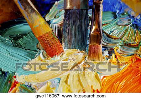 High angle view of paintbrushes mixing paint on a palette View Large Photo Image Stock Photo - High angle view of paintbrushes mixing paint on a palette. Fotosearch