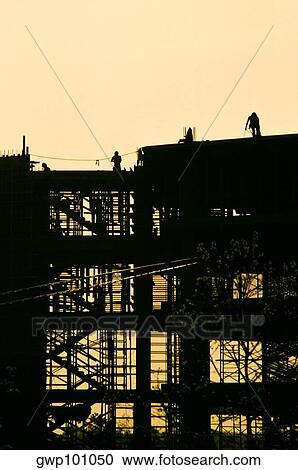 Construction Crane working over new office building View Large Photo Image Stock Image - Construction Crane working over new office building. Fotosearch