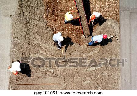 Construction Workers lay concrete, shot from above View Large Photo Image Stock Image - Construction Workers lay concrete, shot from above. Fotosearch