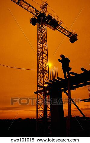 Silhouette of Construction Supervisor on construction location, sunset in the background, Washington DC View Large Photo Image Stock Photography - Silhouette of Construction Supervisor on construction location, sunset in the background, Washington DC. Fotosearch