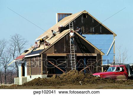 Carpenters putting roof on new home in Maryland View Large Photo Image Stock Image - Carpenters putting roof on new home in Maryland. Fotosearch