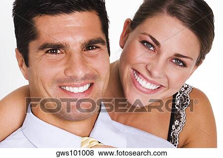 Portrait of a young woman and a mid adult man smiling View Large Photo Image Stock Photo - Portrait of a young woman and a mid adult man smiling. Fotosearch