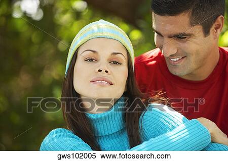 Mid adult man looking at a young woman View Large Photo Image Stock Photography - Mid adult man looking at a young woman. Fotosearch
