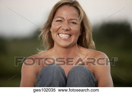 Stock Photography - Portrait of a mature woman smiling. Fotosearch