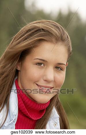 Stock Photo - Portrait of a teenage girl smiling. Fotosearch