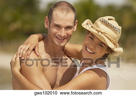 Portrait of a young couple smiling View Large Photo Image Stock Image - Portrait of a young couple smiling. Fotosearch