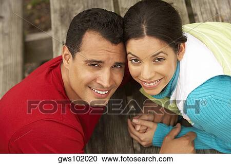 Portrait of a young couple smiling View Large Photo Image Stock Image - Portrait of a young couple smiling. Fotosearch