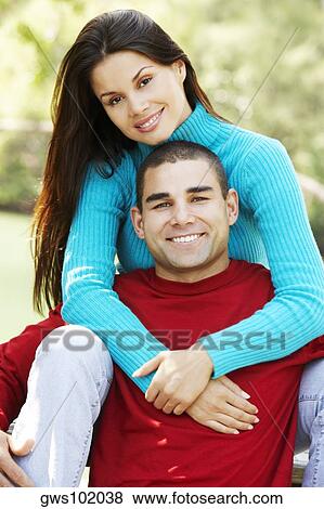 Stock Photo - Portrait of a young couple smiling. Fotosearch