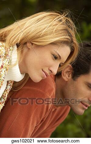 Side profile of a mid adult man and a young woman bending forward View Large Photo Image Stock Image - Side profile of a mid adult man and a young woman bending forward. Fotosearch