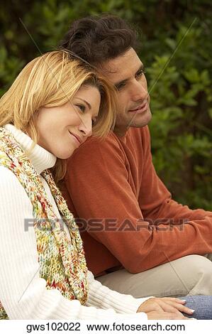 Side profile of a mid adult man and a young woman sitting View Large Photo Image Stock Image - Side profile of a mid adult man and a young woman sitting. Fotosearch