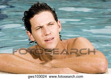 Close-up of a young man in a swimming pool View Large Photo Image Picture - Close-up of a young man in a swimming pool. Fotosearch