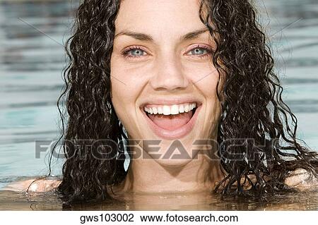 Close-up of a young woman in a swimming pool View Large Photo Image Stock Image - Close-up of a young woman in a swimming pool. Fotosearch