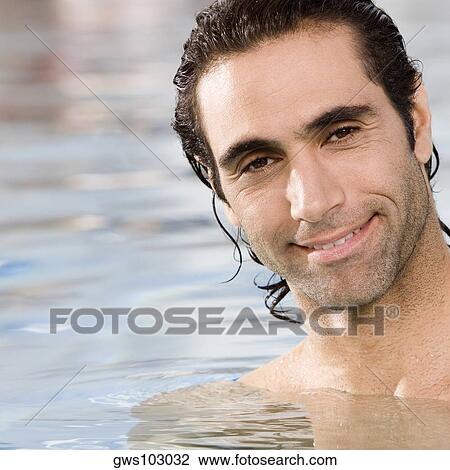 Portrait of a mid adult man swimming in a swimming pool View Large Photo Image Stock Image - Portrait of a mid adult man swimming in a swimming pool. Fotosearch