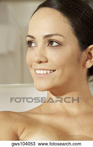 Close-up of a young woman in a bathtub View Large Photo Image Stock Image - Close-up of a young woman in a bathtub. Fotosearch
