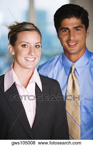 Portrait of a businessman and a businesswoman smiling View Large Photo Image Stock Photo - Portrait of a businessman and a businesswoman smiling. Fotosearch