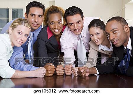 Portrait of a group of business executives pounding their fists on a conference table View Large Photo Image Stock Image - Portrait of a group of business executives pounding their fists on a conference table. Fotosearch