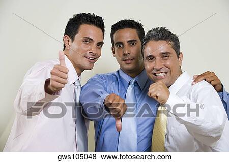 Portrait of three businessmen gesturing thumbs up View Large Photo Image Stock Photo - Portrait of three businessmen gesturing thumbs up. Fotosearch