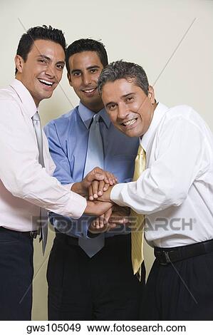 Portrait of three businessmen smiling View Large Photo Image Stock Photo - Portrait of three businessmen smiling. Fotosearch