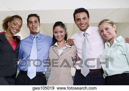 Portrait of two businessmen and three businesswomen smiling View Large Photo Image Stock Photo - Portrait of two businessmen and three businesswomen smiling. Fotosearch