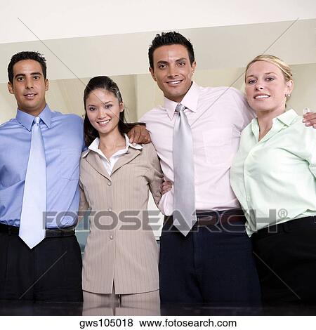 Portrait of two businessmen and two businesswomen smiling View Large Photo Image Stock Photo - Portrait of two businessmen and two businesswomen smiling. Fotosearch