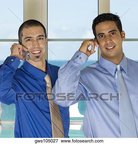 Portrait of two businessmen using mobile phones View Large Photo Image Stock Photo - Portrait of two businessmen using mobile phones. Fotosearch