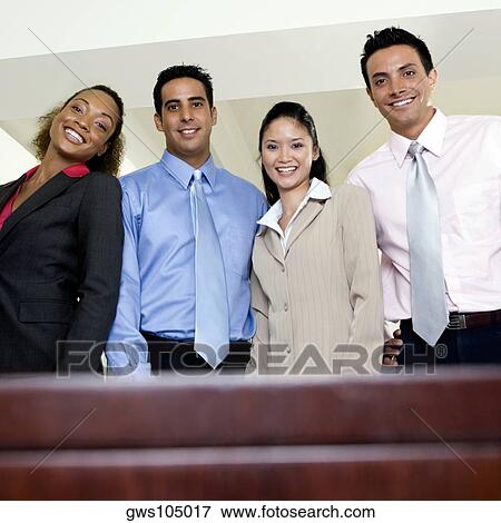 Stock Photo - Portrait of two businesswomen and two businessmen smiling. Fotosearch