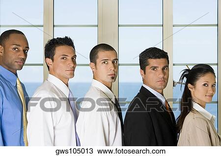 Side profile of four businessmen standing with a businesswoman View Large Photo Image Stock Image - Side profile of four businessmen standing with a businesswoman. Fotosearch