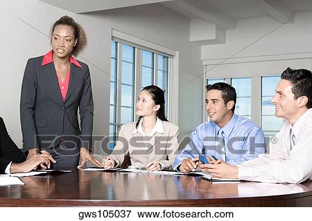 Two businessmen and two businesswomen in a meeting View Large Photo Image Stock Photo - Two businessmen and two businesswomen in a meeting. Fotosearch