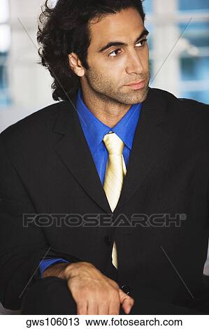 Close-up of a businessman looking sideways View Large Photo Image Stock Image - Close-up of a businessman looking sideways. Fotosearch