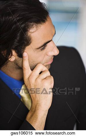 Close-up of a businessman looking sideways View Large Photo Image Stock Photography - Close-up of a businessman looking sideways. Fotosearch
