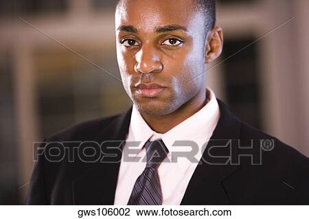 Portrait of a businessman looking serious View Large Photo Image Stock Image - Portrait of a businessman looking serious. Fotosearch